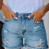 Elegantes shorts vaqueros de mujer con detalles desgastados y flecos - Azul